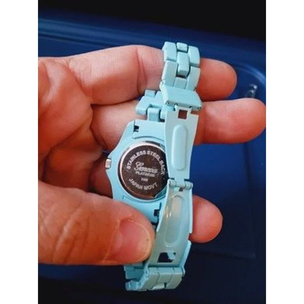 Geneva Platinum watch matching blue link band.